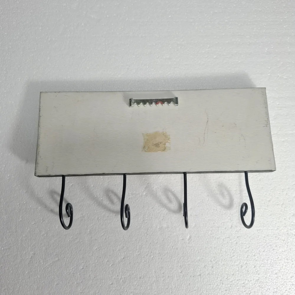 Wall Hook Rack with Black Frame and Red Hat Accent